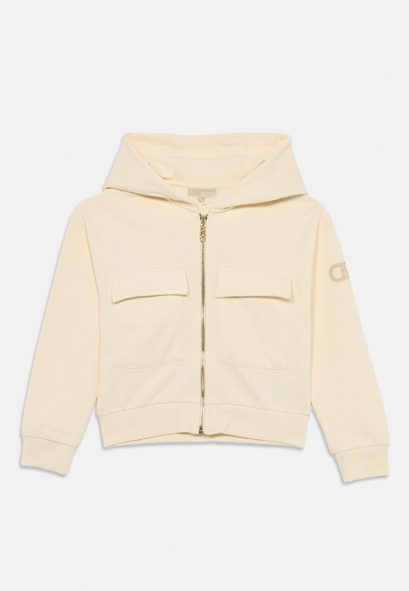 Moletom cor creme com fecho à frente, dois bolsos no peito e punhos canelados. Apresenta um logo na manga e uma textura suave e macia.