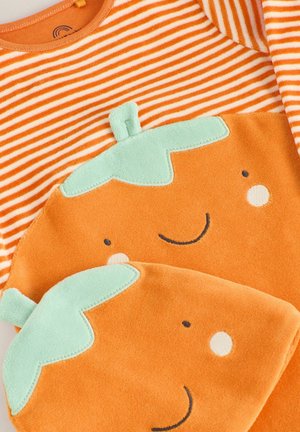 Oranssi raidallinen paita, jossa on pehmeä, hymyilevä tammenterho-muotoilu vaaleassa oranssissa ja mintunvihreässä. Valmistettu pehmeästä, teksturoidusta kankaasta.
