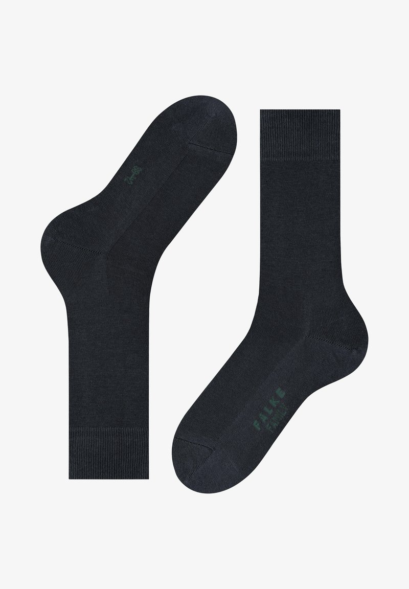 Marineblaue Socken aus einer weichen Baumwollmischung, mit glatter Textur, verstärktem Zehenbereich und dezentem Logo in Grün auf der Sohle.