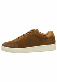 Brown suede sneakers with leather accents, featuring a low top design, round toe, and contrasting beige rubber sole. Laces and perforations detail.