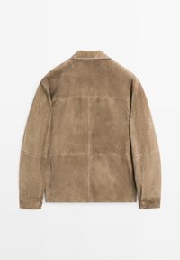 Brown suede jacket with a classic collar, visible stitching, and a smooth texture. Features a straight cut and clean lines.
