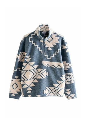 Blue fleece pullover with white geometric patterns, zip collar, and relaxed fit. Textured, soft fabric with decorative detailing.