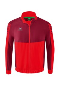 Veste de sport rouge et bordeaux avec un col haut, fermeture éclair, logo blanc et rayures contrastées sur les manches ; tissu lisse et léger.