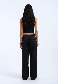 Dr.Denim HILL - Trousers - black