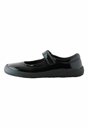 Black Mary Jane shoe with glossy finish, Velcro strap, and thick textured rubber sole shown from the side on a white background.