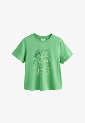 Zielony t-shirt z krótkim rękawem z napisem "Le Petit Pois" i haftowanymi strąkami groszku z małymi białymi koralikami z przodu.