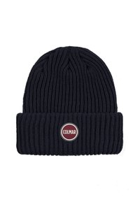 Tumed villane beanie ribblikujulise tekstuuriga, millel on volditud serv ja ümmargune punase ja valge Colmari logo patch esiküljel.