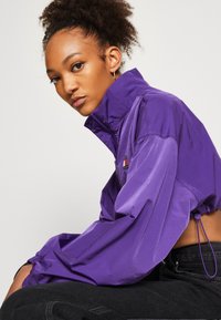 Tommy Jeans Corta-vento - college purple