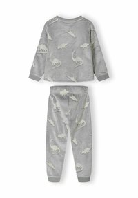 Gray fleece pajamas featuring long sleeves and pants, adorned with light-colored dinosaur silhouettes throughout. Soft texture and elastic cuffs.