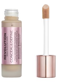 Fond de teint Revolution Conceal & Define dans un flacon transparent avec une étiquette rose. Il est doté d'un applicateur blanc avec un embout en mousse doux.
