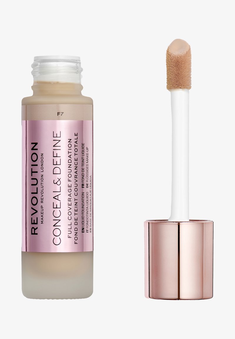 Revolution Conceal & Define foundation in a clear bottle with a pink label. Features a white applicator wand with a soft, sponge tip.