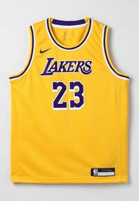 Žlutý basketbalový dres Los Angeles Lakers s purpurovým a bílým obšitím, číslo 23, logo Nike a emblém NBA na spodním lemu.