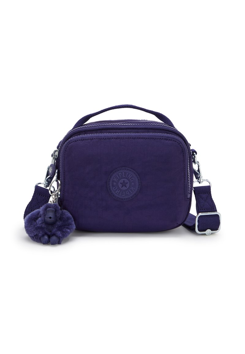 Compact dark purple shoulder bag with short handle, adjustable strap, front zip pocket, and attached furry monkey keychain charm.