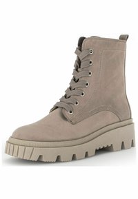 Light beige ankle boots made of suede, featuring a rugged rubber sole, lace-up front, and metallic eyelets. Chunky sole design adds height.