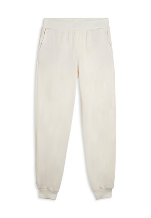 Pantalons de survêtement couleur crème en matière douce, dotés d'une taille élastique, de poches latérales et de poignets fuselés aux chevilles.