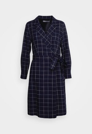 Navy wrap dress with a grid pattern, featuring long sleeves, a belted waist, and a collar. Made from a smooth fabric.