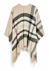 Poncho beige avec un motif tartan noir, blanc, gris et bordeaux, présentant des franges le long du bord inférieur.