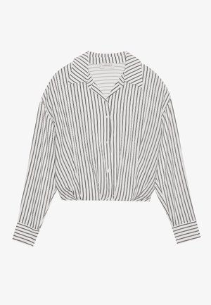 Knappe, cropped bluse i hvit med svarte vertikale striper. Den har krage, lange ermer og en rynket detalj foran.
