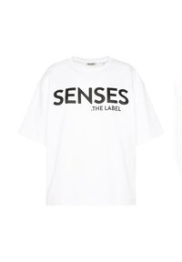 White cotton T-shirt with short sleeves, featuring bold black text that reads "SENSES .THE LABEL" across the front. Relaxed fit.