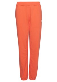 Orange sweatpants tillverkade av mjukt tyg med elastisk midja och muddar vid anklarna. Har en liten logotyp framtill.