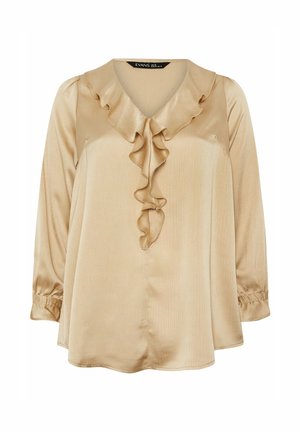 Beige satin blouse with long sleeves, V-neck, and decorative ruffle detail down the front. Textured finish with elasticized cuffs.