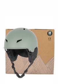 Grøn hjelm med mat overflade, ventilationsåbninger, blød indvendig polstring og justerbar hagerem, vist ved siden af en papkasse.