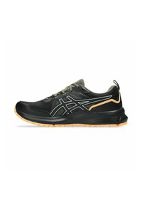 Black athletic shoes featuring a mesh upper, reflective detailing, and a rubber outsole with a textured grip. Yellow accents on the heel.