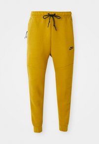 TECH FLEECE - Træningsbukser - ochre black