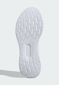 Suola di scarpa atletica bianca con un motivo testurizzato, caratterizzata da scanalature e accenti circolari per trazione e supporto. Finitura in materiale liscio.