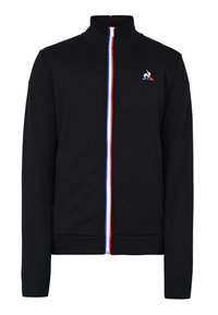 Sudadera negra con cremallera y cuello alto, con rayas rojas, blancas y azules a lo largo de la cremallera y un pequeño emblema en el pecho.