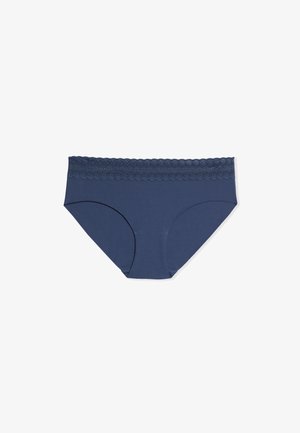 Marineblaue Baumwollslip mit einer gewellten Spitzen-Bundverzierung. Glatte Textur, voll bedeckendes Design mit nahtlosen Kanten für mehr Komfort.