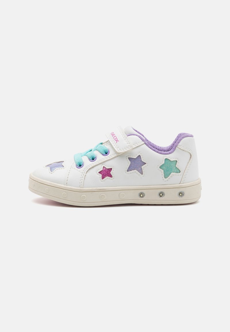 White sneaker with star-shaped cutouts in purple, pink, and teal, featuring a turquoise lace and Velcro strap. Rubber sole with decorative accents.