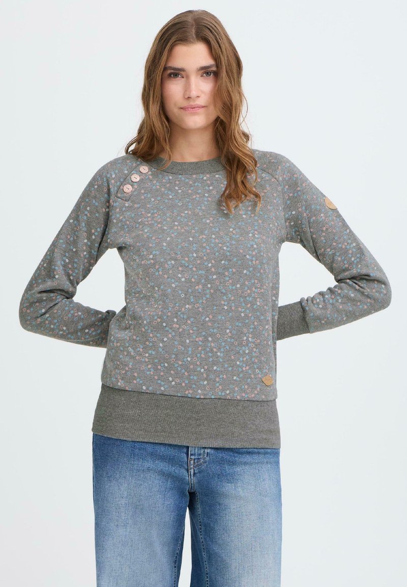 Szürke virágmintás pulóver kis kék és rózsaszín pöttyökkel, bordázott mandzsettákkal és kerek nyakkivágással. Gombos díszítés a vállon és logó részlet található rajta.