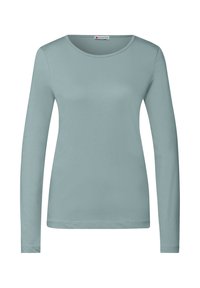 Top de manga larga en un azul claro suave, hecho de tela lisa. Presenta un cuello redondo y un diseño simple sin patrones o acentos visibles.