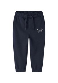 Granatowe dresy z elastycznym pasem i sznurkiem do regulacji, z białym haftowanym wzorem jamnika na lewym biodrze.