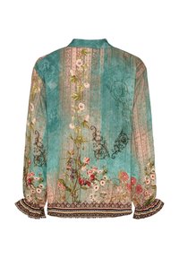 Langærmet skjorte med et teal- og pink-blomstermotiv. Har volangmanchetter og intrikate mønstre ved kanten og skulderne.
