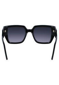 Black rectangular sunglasses with gradient gray lenses, glossy finish, wide temples, and accent hardware near the hinges.