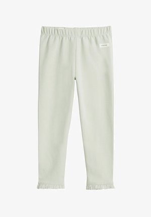 Lichtgroene legging gemaakt van zachte stof met een elastische taille en ruches aan de onderkant. Merkenlabel gestikt op de taille.