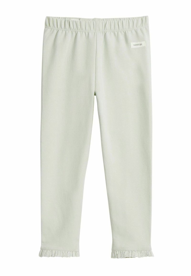 Lichtgroene legging gemaakt van zachte stof met een elastische taille en ruches aan de onderkant. Merkenlabel gestikt op de taille.