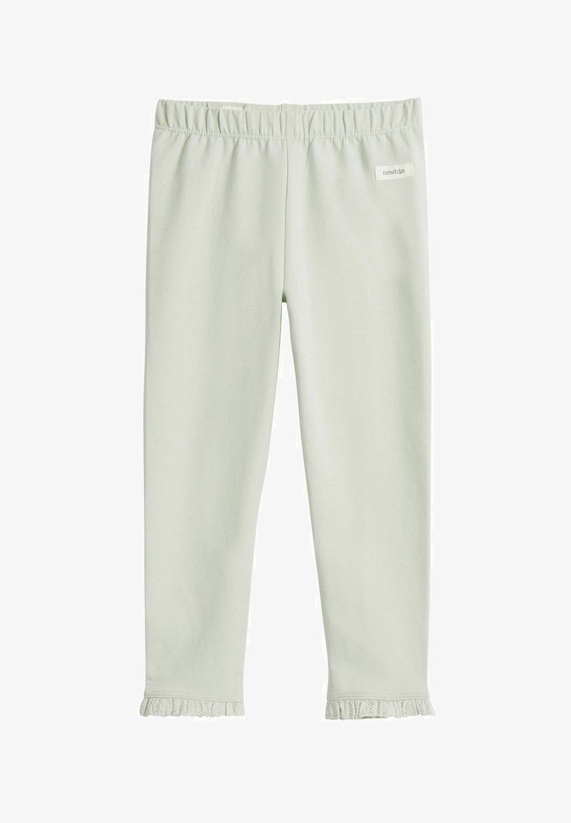Jasnozielone legginsy wykonane z miękkiego materiału z elastycznym pasem i falbaną u dołu. Metka marki wszyta w pas.