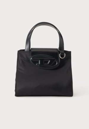 Small black handbag with two short handles, a front flap, and a raised oval logo detail, set against a plain white background.