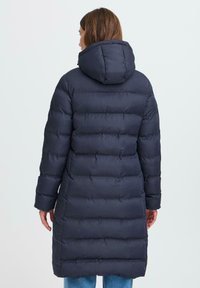 Navy puffer coat with a hood, featuring a quilted design, long sleeves, and a straight cut. Smooth texture with elastic cuffs.