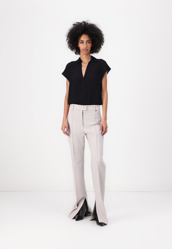 PANTALONE CON SPACCO - Trousers