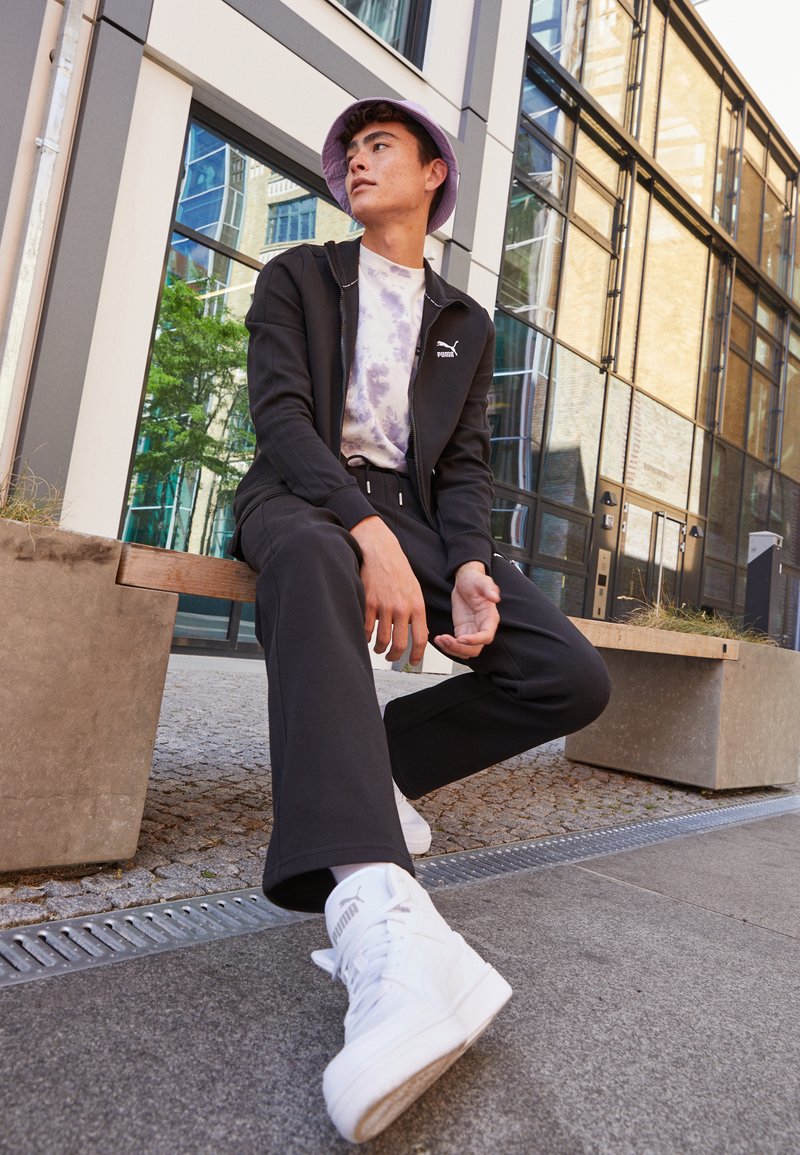 Puma TRACK PANTS - Teplákové kalhoty - black