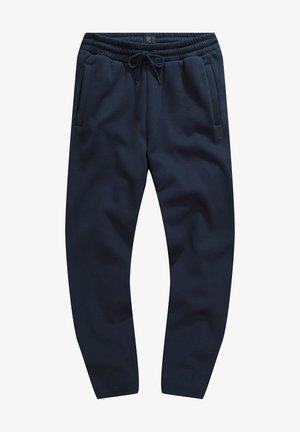 Pantalones de chándal color navy hechos de una tela suave, con cintura elástica, cordón y dos bolsillos laterales. Textura suave y diseño ajustado.