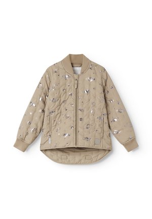Veste matelassée beige avec imprimé métallique représentant une planète et la lune, fermeture éclair à l’avant, poignets côtelés, et ourlet arrière légèrement plus long.