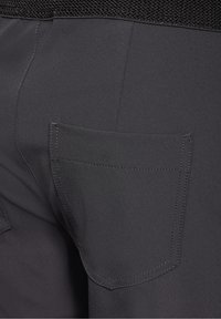 Grå byxor med en texturerad svart midjeband, med en enda bakficka och rena sömdetaljer. Slät tygfinish.