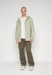 Rains JACKET UNISEX - Parka - earth