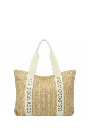 Bolso tote tejido beige con asas anchas en color crema que presentan el texto "U.S. POLO ASSN." en posición vertical a lo largo de cada correa.