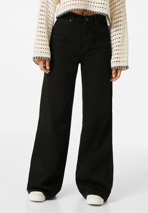 WIDE-LEG - Flared Jeans - black